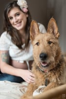 trendy pregnant woman with her pet dog